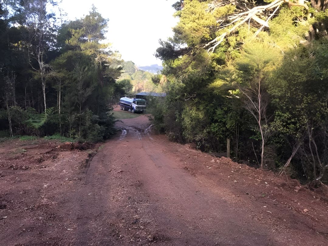Tapped Out water truck accessing a difficult forest property via a rural dirt road